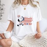 Patriotic Snoopy Wearing Uncle Sam Hat with American Flag Background 4th Of July 1 T Shirt