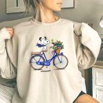 Snoopy Riding Gators Bike with Florida Gators Logo and Basket of Flowers 3 Sweatshirt.jpg