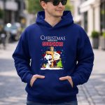 Snoopy and Charlie Brown Cross Christmas Begins With Sooners 8 Hoodie.jpg