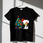 Snoopy and Woodstock Celebrating Christmas by the Tree 1 T Shirt 1.jpg