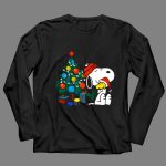 Snoopy and Woodstock Celebrating Christmas by the Tree 4 Long Sleeves 1.jpg